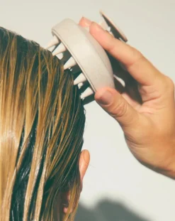 Scalp stimulating brush